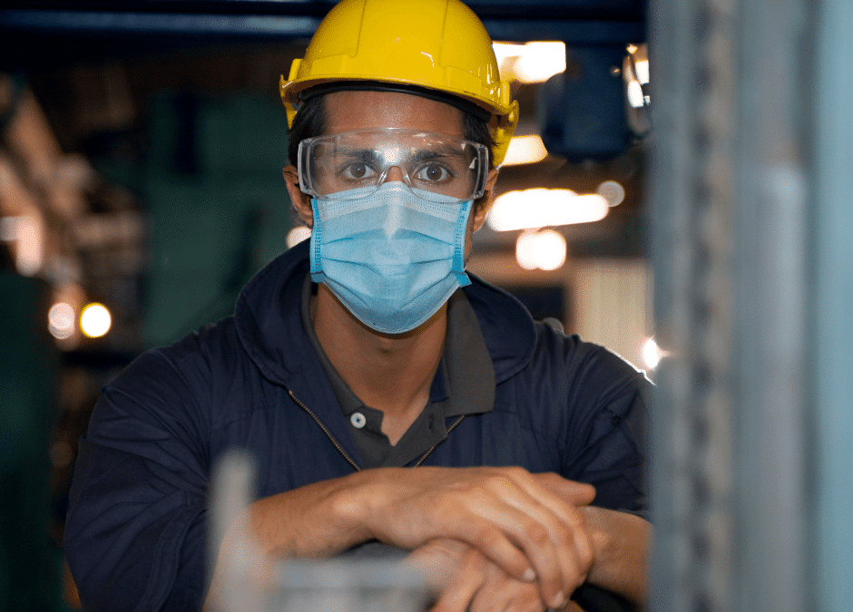 Man in factory wearing face mask